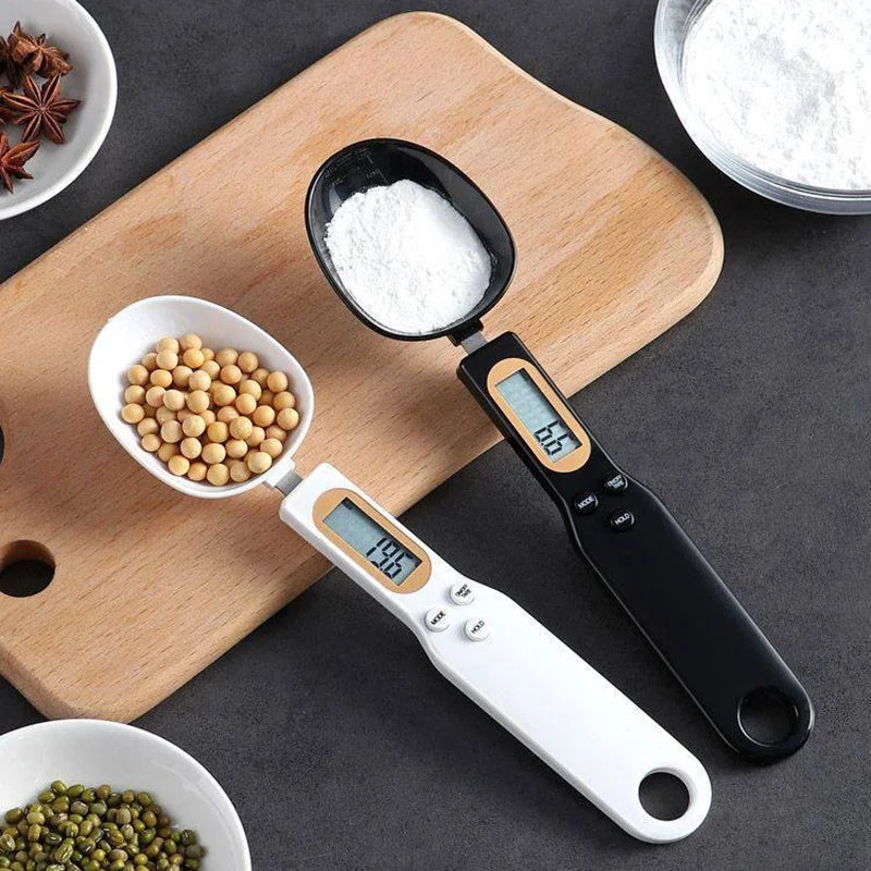 Digital measuring spoon with digital display on a wooden cutting board with ingredients